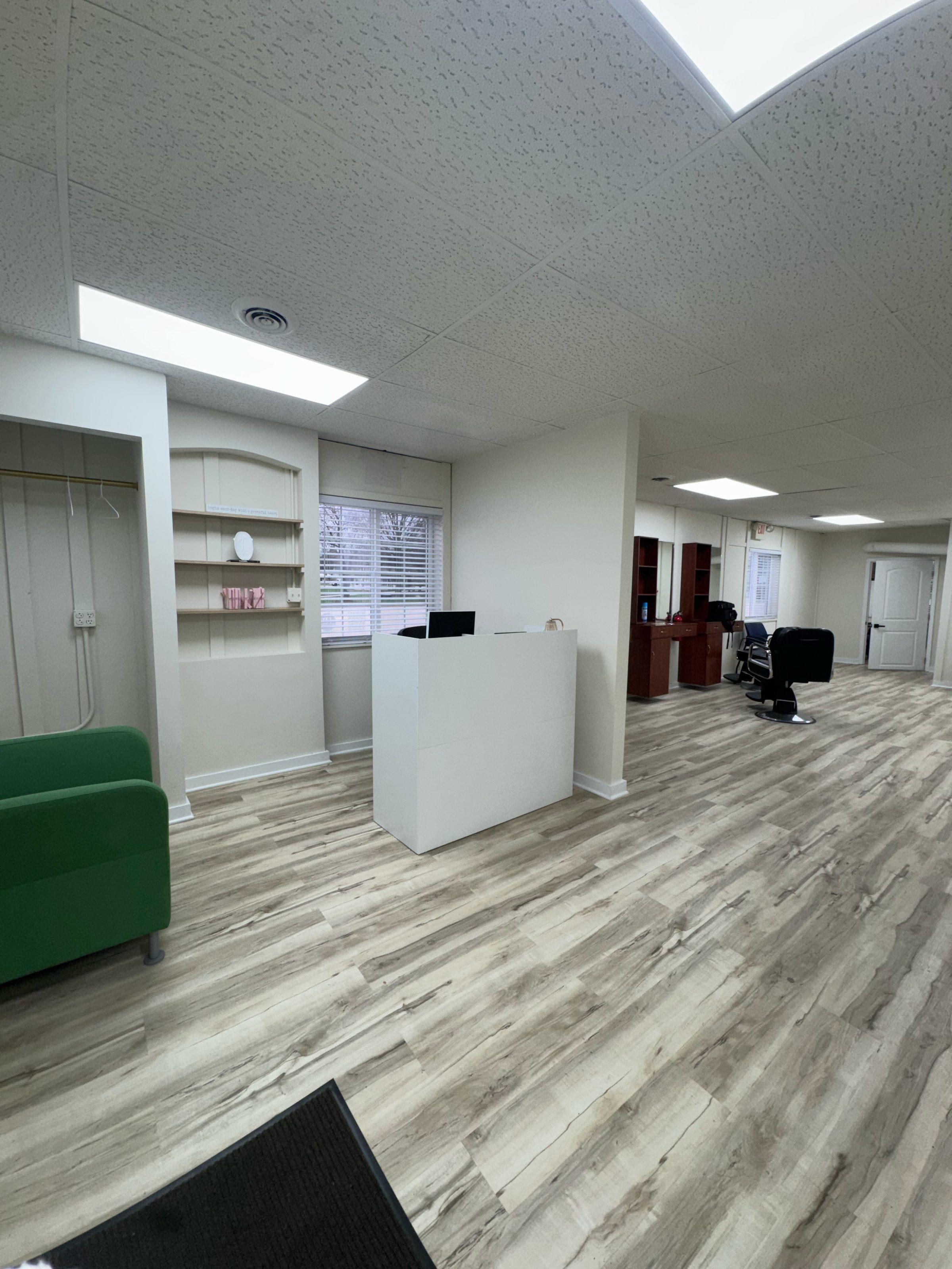 Open salon floor with styling stations, ready for new artists